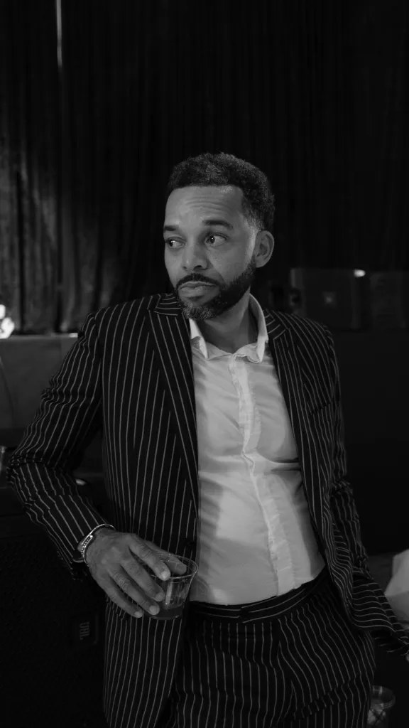 Chris Redd in pinstripe suit